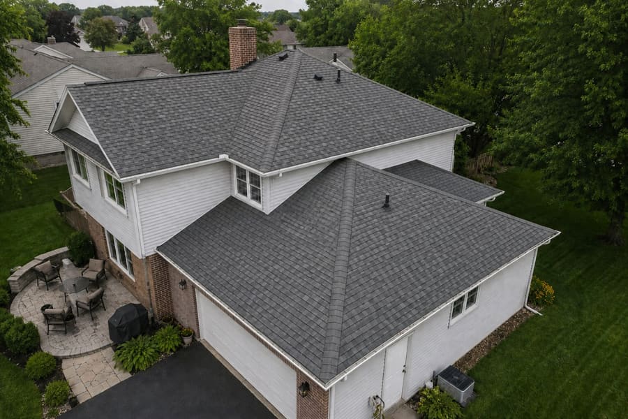 The same roof after replacement with algae-resistant architectural shingles