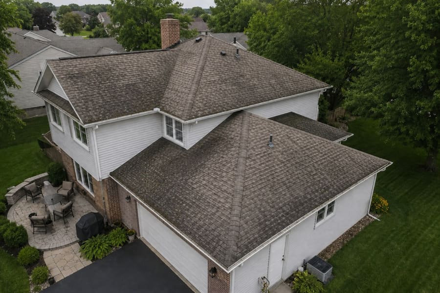 Roof with algae staining and discoloration before replacement